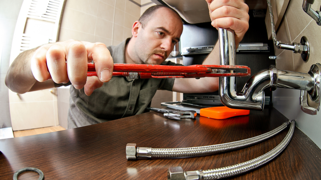 plumber under sink
