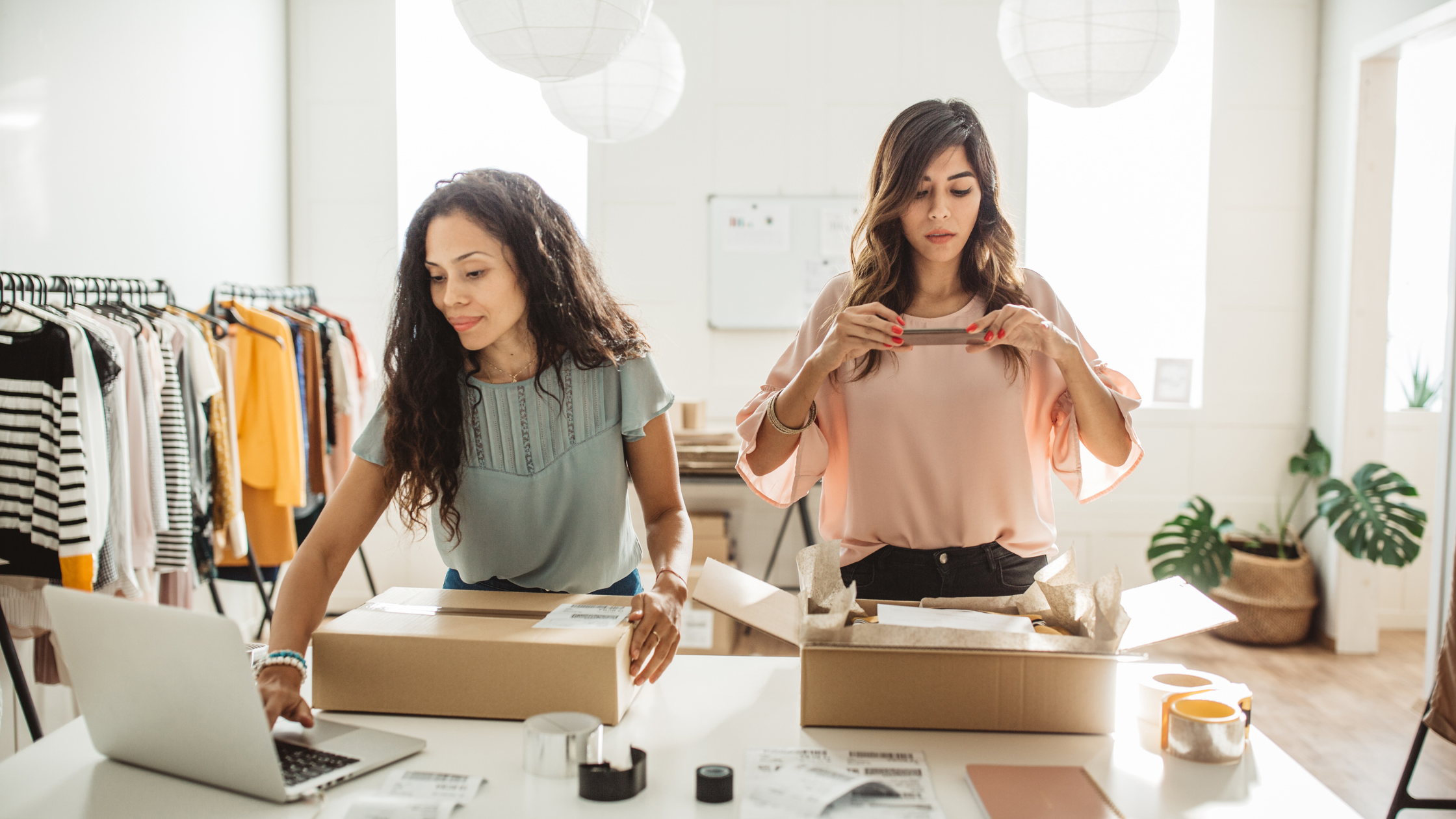 business owners packing parcels