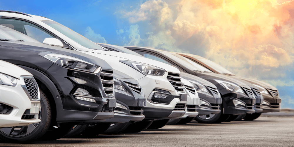 Line of modern cars parked together, representing fleet vehicle insurance and commercial motor cover