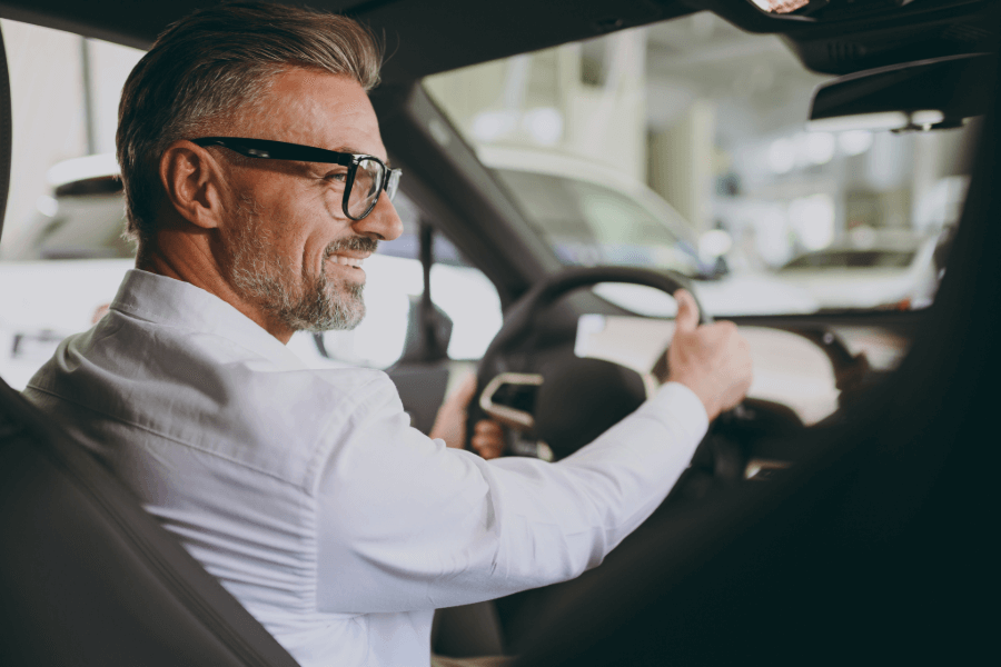 Professional driver in a modern car, representing comprehensive motor insurance
