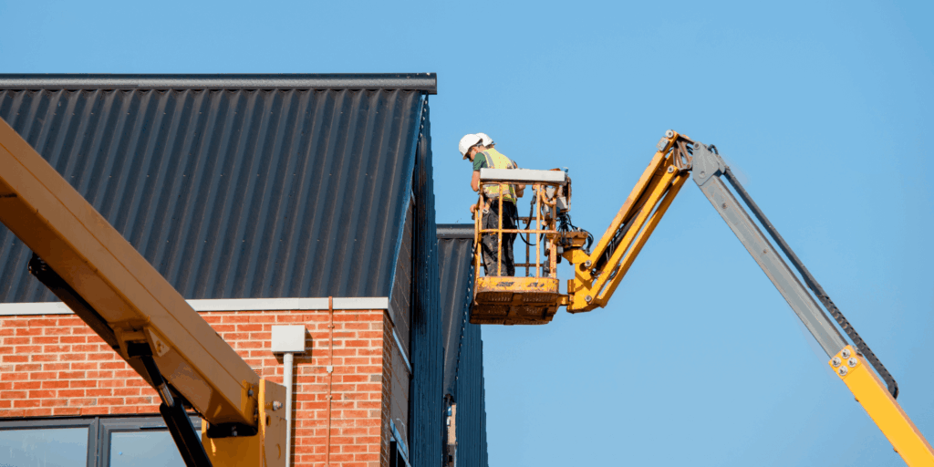 Boom lift access equipment used for insured building maintenance work