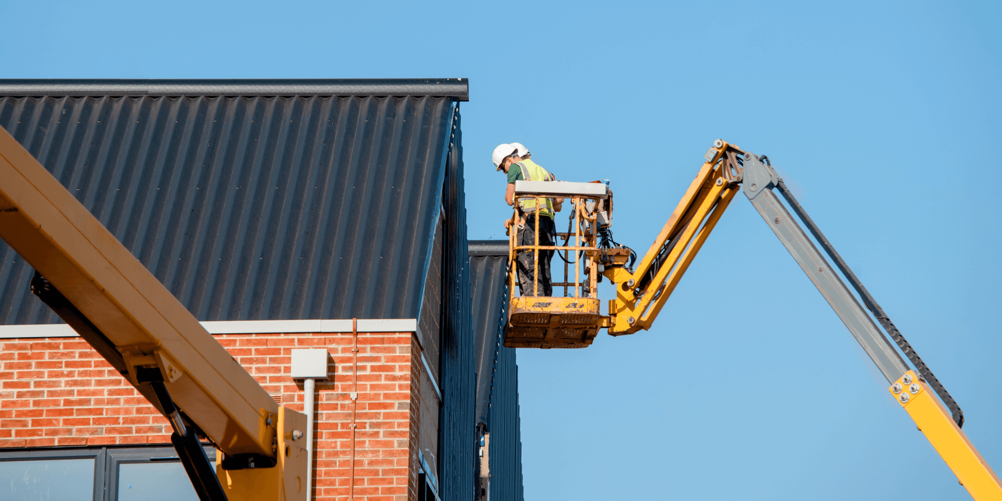 Boom lift access equipment used for insured building maintenance work