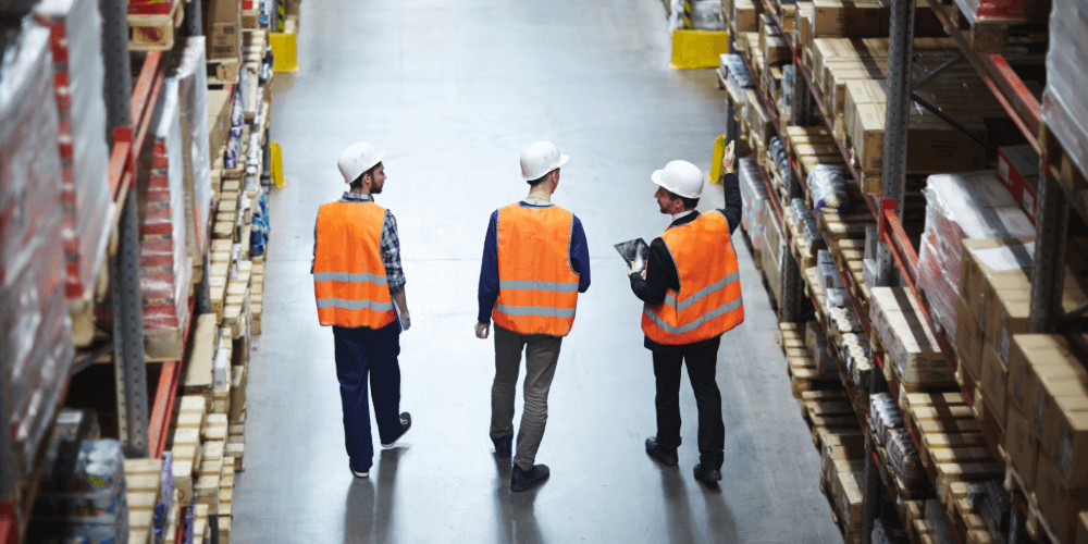 workers checking the warehouse is insured