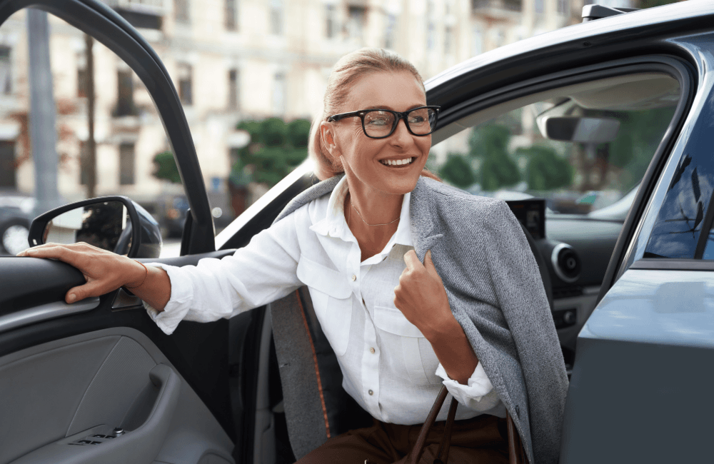 woman getting out of a car