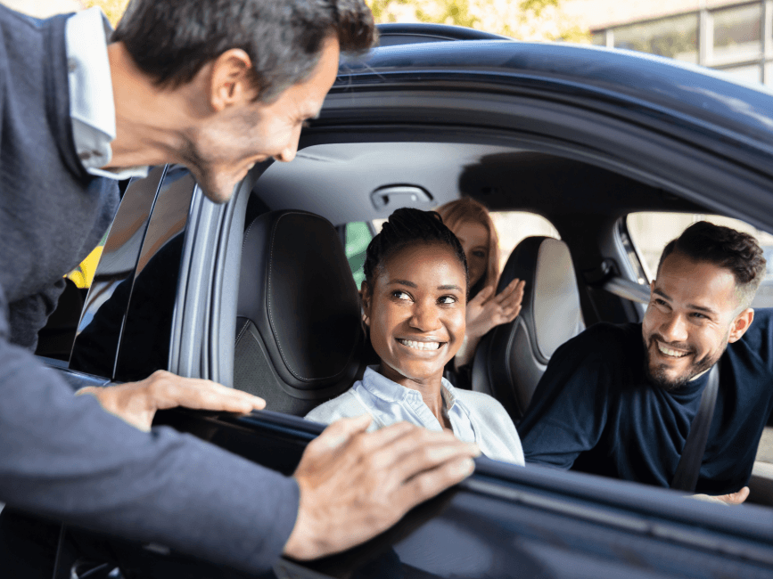 business people sharing car
