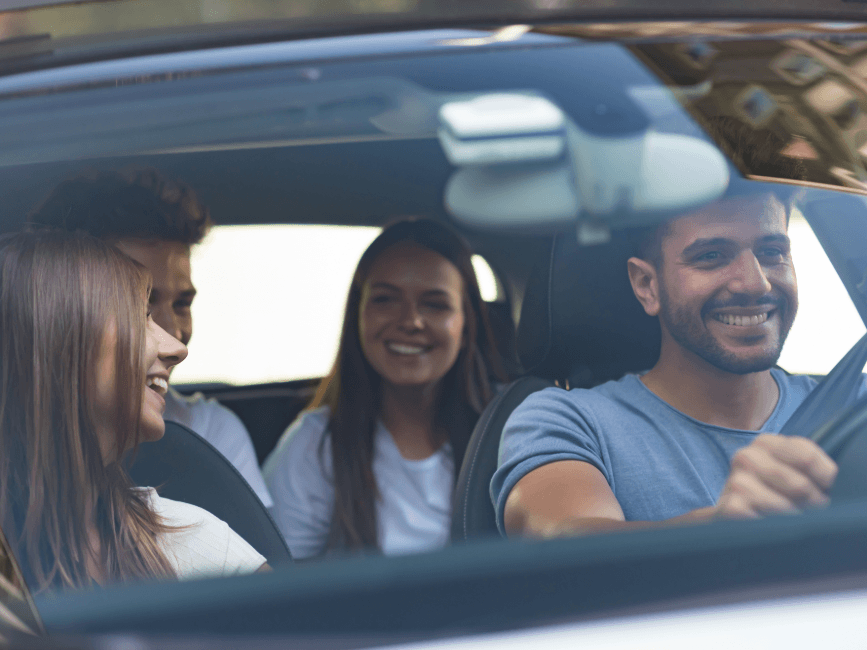 happy people sharing a car