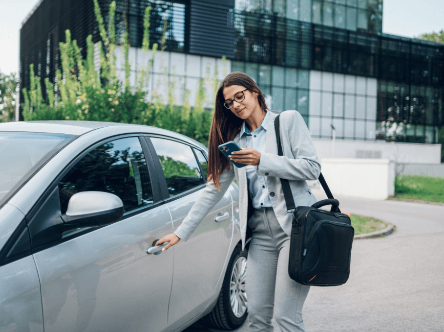 woman getting into her car